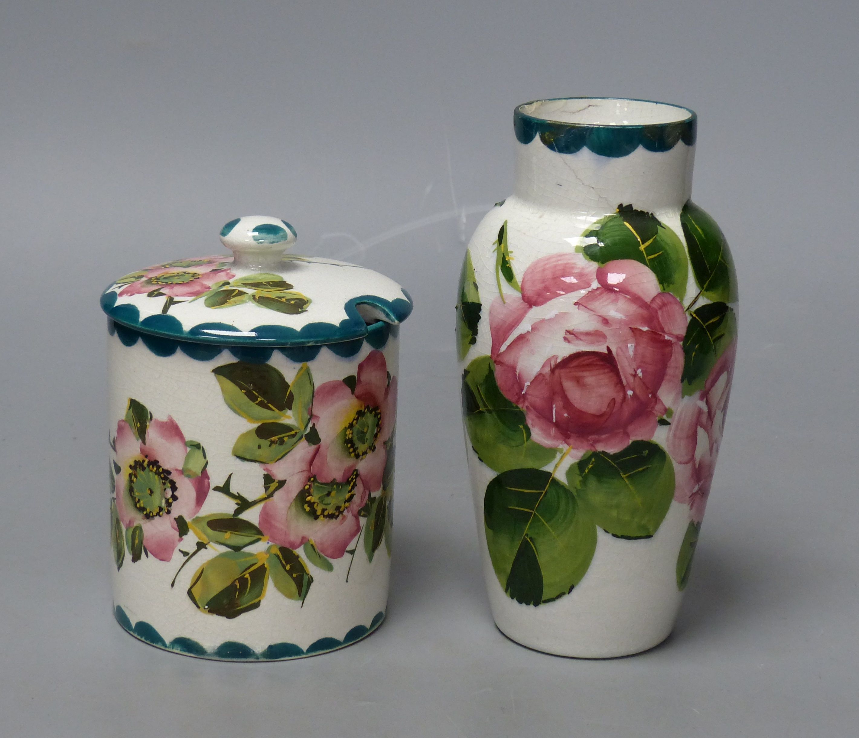A Wemyss cabbage rose vase and a wild rose pattern lidded preserve jar, tallest 16cm